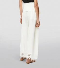 LOEWE x Paula’s Ibiza Macramé Belted Trousers ECRU Tailored Trousers -LOEWE Sales loewe x paulas ibiza macrame belted trousers 16726216 32825870 1000